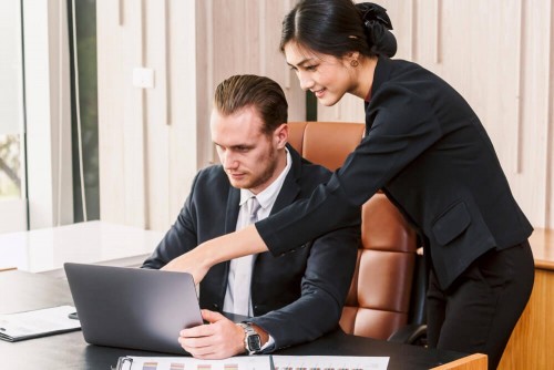 young-man-using-mobile-phone-while-sitting-office850f4aef2eeb1eaf.jpg